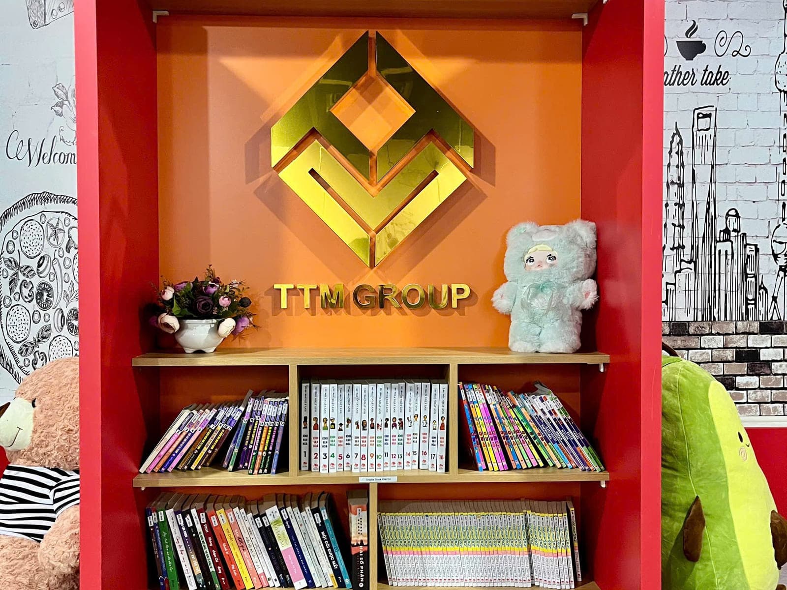 Góc sách nhỏ đặt cạnh logo công ty